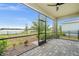 Screened porch overlooking backyard and lake at 17708 Fallen Branch Way, Punta Gorda, FL 33982