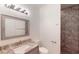 Bathroom with granite vanity and tile shower at 23098 Ambassador Ave, Port Charlotte, FL 33954