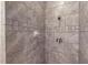 Large tiled shower with built-in soap dish at 23098 Ambassador Ave, Port Charlotte, FL 33954