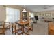 Dining area with table and chairs, and a view into the living room at 22557 Bolanos Ct, Port Charlotte, FL 33952