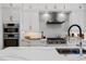 Sleek kitchen with white cabinetry, stainless steel appliances, and a large island at 2511 Rio Largo Ct, Punta Gorda, FL 33950