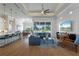 Open living room with hardwood floors and large windows at 2511 Rio Largo Ct, Punta Gorda, FL 33950