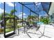 Screened lanai with lounge chairs overlooking the canal and pool at 2511 Rio Largo Ct, Punta Gorda, FL 33950