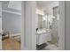 Modern bathroom with floating vanity, walk-in shower, and gray tile at 2511 Rio Largo Ct, Punta Gorda, FL 33950