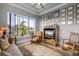 Bright office with hardwood floors, large windows, and a wall of framed photos at 2511 Rio Largo Ct, Punta Gorda, FL 33950