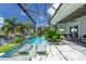 Screened-in pool and patio area with lounge chairs at 2511 Rio Largo Ct, Punta Gorda, FL 33950