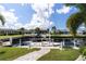 Private dock with sailboat and pathway, offering access to the waterway at 2511 Rio Largo Ct, Punta Gorda, FL 33950
