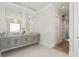 Bathroom with double vanity, large mirrors, and modern light fixtures at 2511 Rio Largo Ct, Punta Gorda, FL 33950