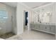 Elegant bathroom with a large vanity, walk-in shower, and separate toilet area at 2511 Rio Largo Ct, Punta Gorda, FL 33950