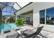 Lush patio with pool and spa, offering comfortable seating and canal views at 2511 Rio Largo Ct, Punta Gorda, FL 33950