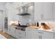 Modern kitchen with stainless steel appliances and white shaker cabinets at 2511 Rio Largo Ct, Punta Gorda, FL 33950