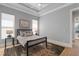 Bright bedroom with a metal framed bed, nightstands, and area rug at 2511 Rio Largo Ct, Punta Gorda, FL 33950