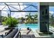 Relaxing pool area with water features, lounge chairs, and waterfront views at 2511 Rio Largo Ct, Punta Gorda, FL 33950