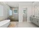 Spa-like bathroom with soaking tub, walk-in shower, and dual vanities at 2511 Rio Largo Ct, Punta Gorda, FL 33950