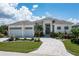 Two-story home with a two-car garage and nicely landscaped yard at 2511 Rio Largo Ct, Punta Gorda, FL 33950