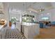 Modern kitchen with white cabinetry, large island, and wine cooler at 2511 Rio Largo Ct, Punta Gorda, FL 33950