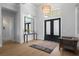 Bright entry with hardwood floors, large mirror, and double doors at 2511 Rio Largo Ct, Punta Gorda, FL 33950