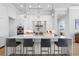 Modern kitchen features a large island with seating and white cabinets at 2511 Rio Largo Ct, Punta Gorda, FL 33950