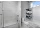 Clean bathroom with toilet, floating shelves and walk in shower at 2511 Rio Largo Ct, Punta Gorda, FL 33950