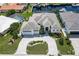Aerial view showing home's exterior, landscaping, and driveway at 2511 Rio Largo Ct, Punta Gorda, FL 33950
