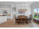Bright dining room with hardwood floors and large windows at 2511 Rio Largo Ct, Punta Gorda, FL 33950