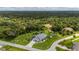 Aerial view of a single-Gathering home with a large backyard and lush landscaping at 196 Lecturn St, Port Charlotte, FL 33954