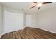 Bedroom with double door closet and vinyl plank flooring at 860 Phyllis St, Port Charlotte, FL 33948