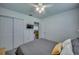 Bright bedroom with a queen bed, double doors to the living room, and a TV at 27359 Whitman Ave, Punta Gorda, FL 33983