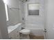 Clean bathroom with a tub-shower combo, white vanity, and updated fixtures at 2000 Bal Harbor Blvd # 1012, Punta Gorda, FL 33950