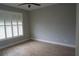 Empty bedroom with shutters and tile floor at 2000 Bal Harbor Blvd # 1012, Punta Gorda, FL 33950