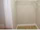 A walk-in closet with white shelving and a wood-look tile floor at 2000 Bal Harbor Blvd # 1012, Punta Gorda, FL 33950