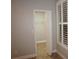 A bedroom closet with white shelving and a wood-look tile floor at 2000 Bal Harbor Blvd # 1012, Punta Gorda, FL 33950