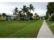 Condo community featuring lush landscaping, shade trees, and sidewalks at 2000 Bal Harbor Blvd # 1012, Punta Gorda, FL 33950