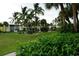 Well-manicured community with lush landscaping and tropical palm trees at 2000 Bal Harbor Blvd # 1012, Punta Gorda, FL 33950