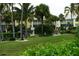 Condo community featuring lush landscaping, shade trees and a beautiful lawn at 2000 Bal Harbor Blvd # 1012, Punta Gorda, FL 33950