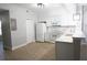 Well-lit kitchen with white cabinetry, stainless steel appliances, and ample counter space at 2000 Bal Harbor Blvd # 1012, Punta Gorda, FL 33950