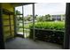 Screened-in lanai with water view and lush tropical landscaping at 2000 Bal Harbor Blvd # 1012, Punta Gorda, FL 33950