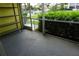 Screened-in lanai overlooks a waterway with lush tropical landscaping at 2000 Bal Harbor Blvd # 1012, Punta Gorda, FL 33950
