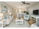 Inviting living room with comfortable seating, coastal decor, and an open view to the kitchen at 2000 Bal Harbor Blvd # 1012, Punta Gorda, FL 33950