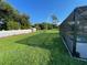 Spacious backyard, grassy area, and pool at 240 Cicero Nw St, Port Charlotte, FL 33948