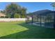 Large backyard with screened pool and shed at 240 Cicero Nw St, Port Charlotte, FL 33948