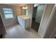 Modern bathroom with white vanity, tile floors and walk-in shower at 240 Cicero Nw St, Port Charlotte, FL 33948