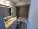 Bathroom with beige tile, a tub and white vanity at 240 Cicero Nw St, Port Charlotte, FL 33948