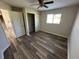 Bedroom with laminate flooring, closet and ceiling fan at 240 Cicero Nw St, Port Charlotte, FL 33948