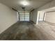 Two-car garage with work area and storage at 240 Cicero Nw St, Port Charlotte, FL 33948