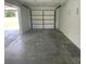 Attached garage with ample storage space at 240 Cicero Nw St, Port Charlotte, FL 33948
