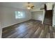Spacious living room with laminate flooring and stairs at 240 Cicero Nw St, Port Charlotte, FL 33948