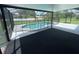 Spacious screened patio area with a view of the pool at 240 Cicero Nw St, Port Charlotte, FL 33948