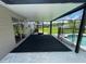 Screened patio with view of the backyard and swimming pool at 240 Cicero Nw St, Port Charlotte, FL 33948