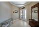 Bright and spacious entryway with tile flooring and a wooden coat rack at 3959 San Rocco Ct # 911, Punta Gorda, FL 33950